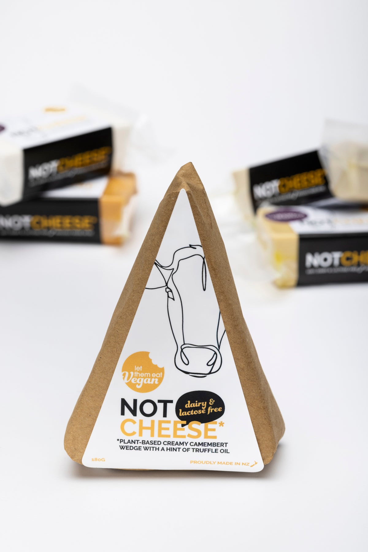 Camembert Wedge — vegan camembert-style cheese with truffle oil by Let Them Eat Vegan, front of pack