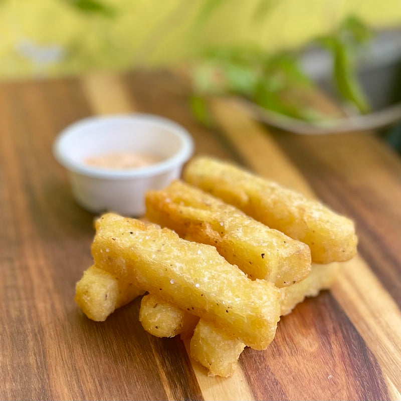 Golden hash sticks with a pot of dipping sauce