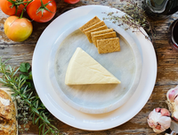 Camembert Wedge — vegan camembert-style cheese with truffle oil, serving suggestion