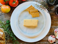 Onion & Chive Cheddar — vegan onion and chive cheddar-style cheese, serving suggestion